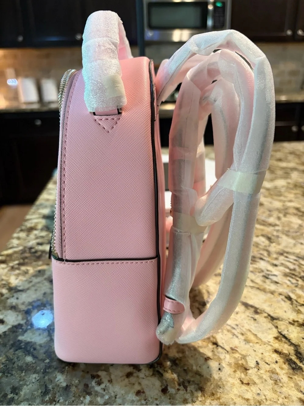 kate spade pastel pink mini backpack with front pocket
